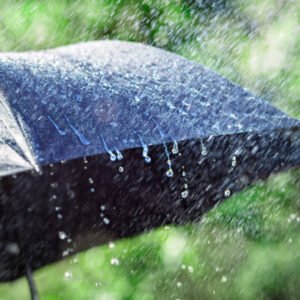 Rain on umbrella background, weather forecast and environmental concept